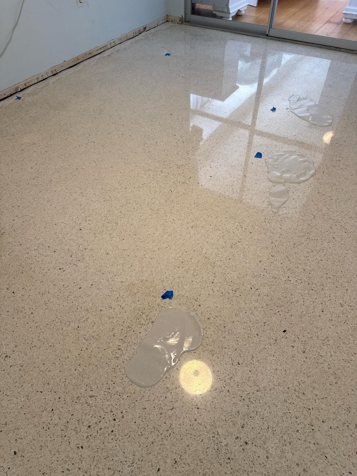 Poultice treatments applied to a terrazzo floor for stain removal