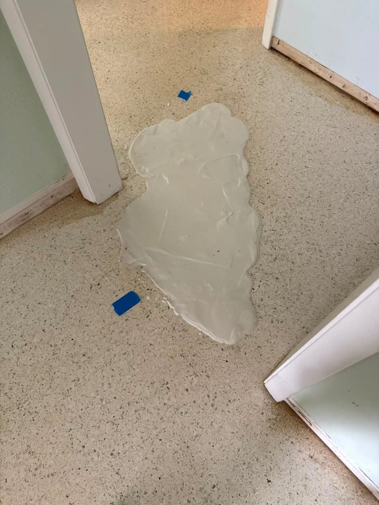 A poultice treatment applied to a terrazzo floor for stain removal