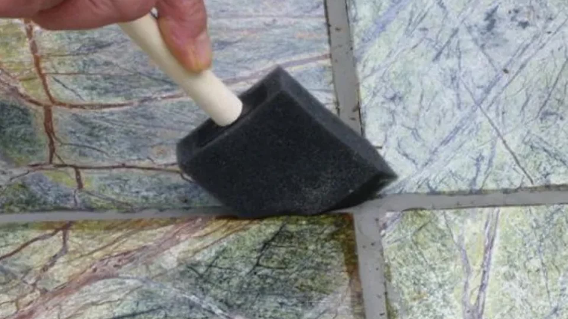 Applying penetrating sealer to a marble floor